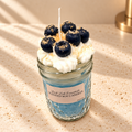 Blueberry Maple Crunch Scented Soy Candle on an ivory stone surface