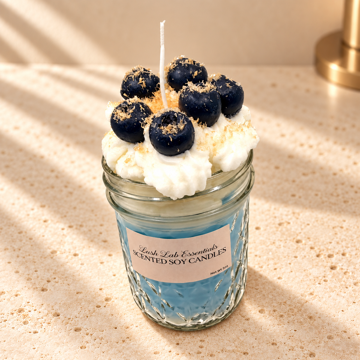 Blueberry Maple Crunch Scented Soy Candle on an ivory stone surface