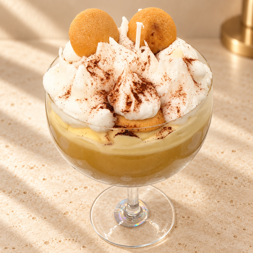 Banana Pudding Scented Soy Candle on an ivory stone surface