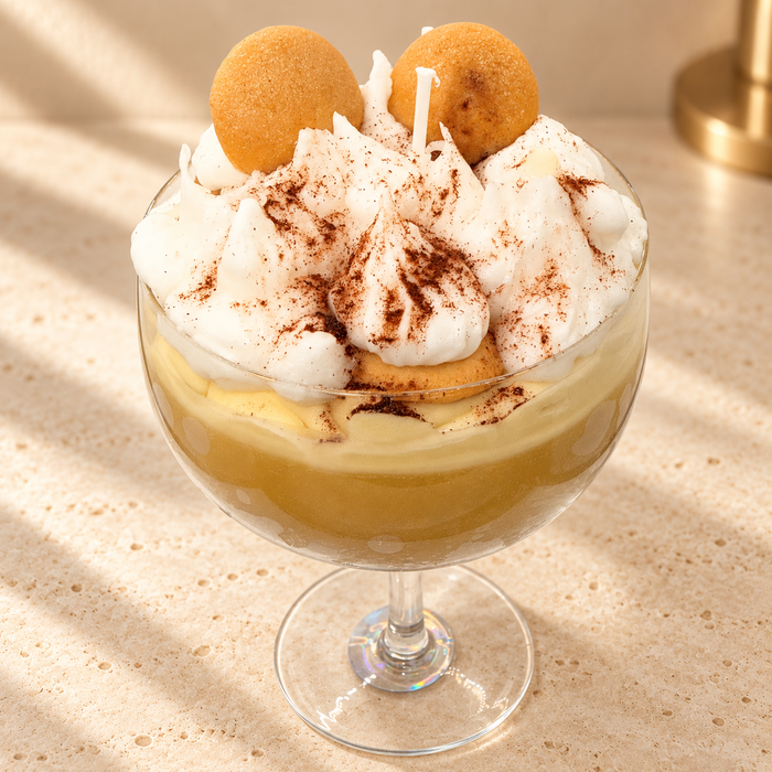 Banana Pudding Scented Soy Candle on an ivory stone surface